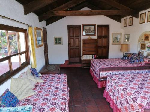 Ένα ή περισσότερα κρεβάτια σε δωμάτιο στο La Casa de la Abuela