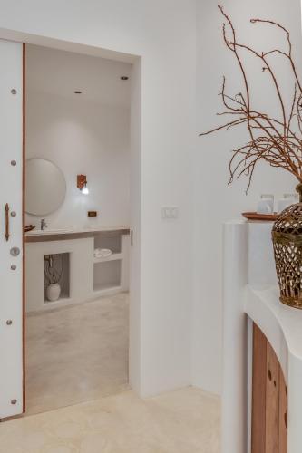a room with a door leading into a living room at Ampersand Resort in Bophut 