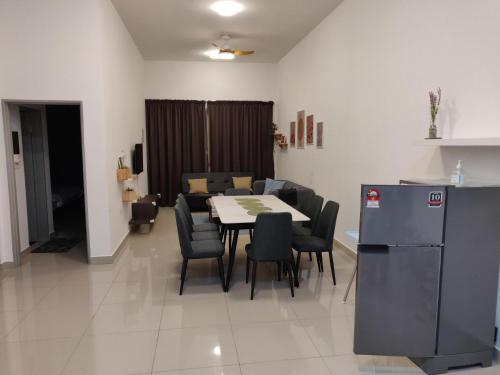 a kitchen and dining room with a table and chairs at Mars Homestay in Kea Farm Brinchang in Brinchang