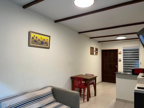 a living room with a couch and a table at Le 5 Nord in Cayenne