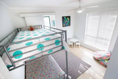 a bedroom with a bunk bed with a bunk bed frame at Coorong Lakeside Cottage in Meningie