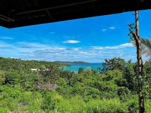 a view of the ocean from a hill with trees at Sweet View Guesthouse in Koh Rong
