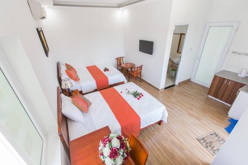 Postel nebo postele na pokoji v ubytování Blue Moon Hotel Mui Ne