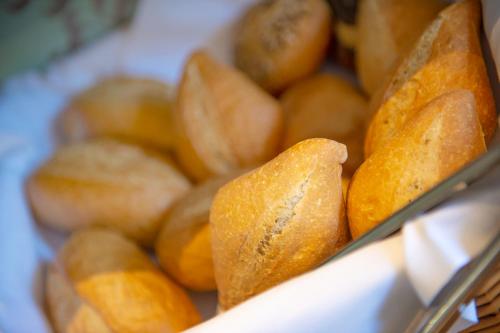 a pile of breads in a box at Hotel Residenz am Rosengarten in Bad Kissingen