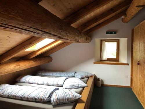 a room with three pillows sitting on the floor at Alte Sennerei in Ober-Says