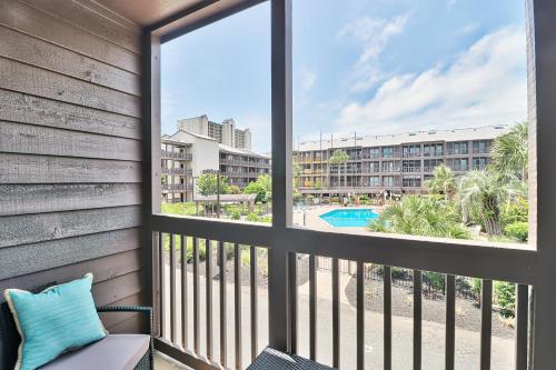 a balcony with a view of the pool and buildings at Beach &nightlife 3BR/2.5 BA service dog friendly in Myrtle Beach
