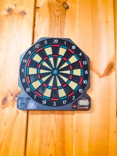a dart board on a wooden table at Agroturystyka Pod Złotą Wiechą in Uście Gorlickie