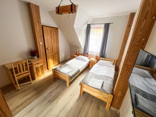 Postel nebo postele na pokoji v ubytování Gościniec Smrekowa Chata