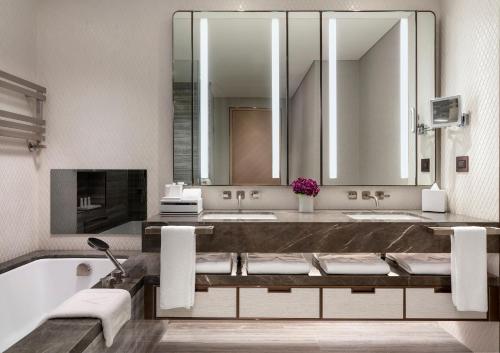 a bathroom with two sinks and a large mirror at Address Istanbul in Istanbul