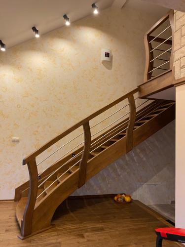 a loft bed with a staircase in a room at Dom Wiktor in Tarnowiec