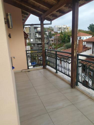 a balcony with a view of a city at SMILE in Platamonas