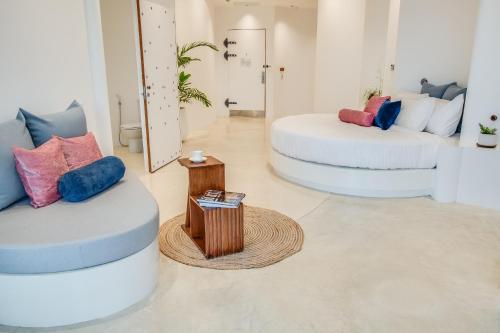 a room with two bean chairs and a table at Ampersand Resort in Bophut 