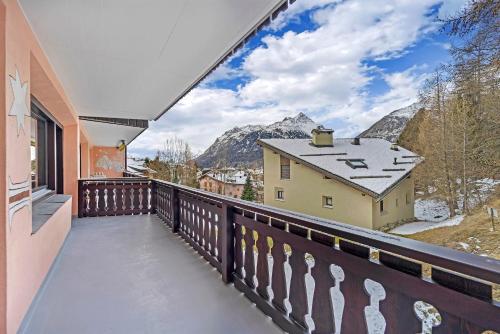 a balcony with a view of the mountains at Guardaval 15 in Surlej
