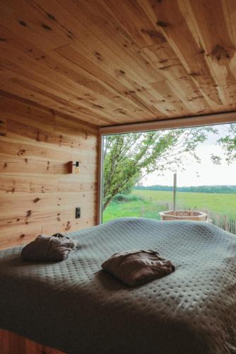 Postel nebo postele na pokoji v ubytování La cabane de la Ferme du Ry