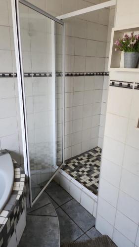 a bathroom with a shower and a sink at Debbie's Den in Springs