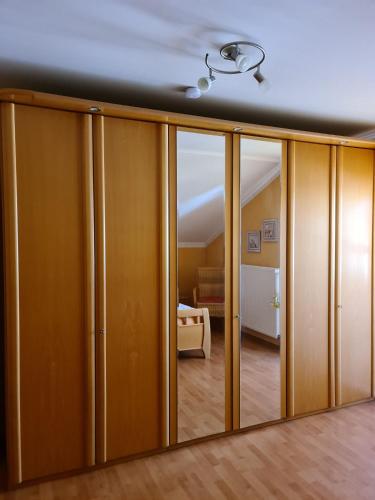 a room with sliding glass doors and a bedroom at Ferienwohnung HOAMAT Schmalzreich Andrea in Lam