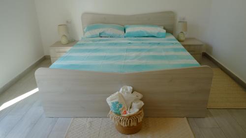 En eller flere senge i et værelse på Villetta La Caletta