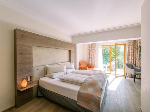 Postel nebo postele na pokoji v ubytování Garten-Hotel Ochensberger
