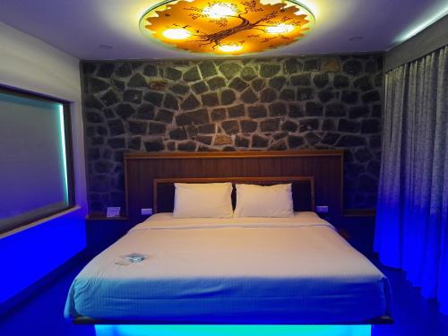 Un ou plusieurs lits dans un hébergement de l'établissement GReaT Trails Yercaud by GRT Hotels