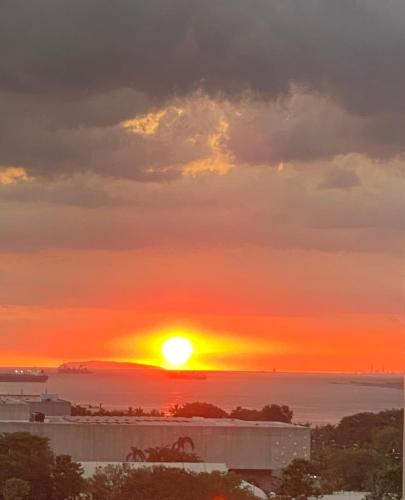 a sunset from the roof of a building at Le 10 The Radiance Manila Bay in Manila