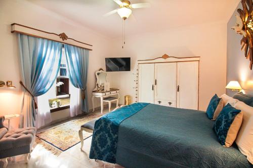 Katil atau katil-katil dalam bilik di Casa Nostra Boutique Hotel