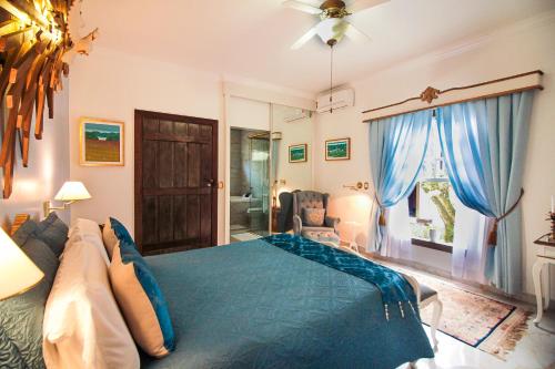 Katil atau katil-katil dalam bilik di Casa Nostra Boutique Hotel
