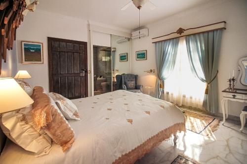 Katil atau katil-katil dalam bilik di Casa Nostra Boutique Hotel