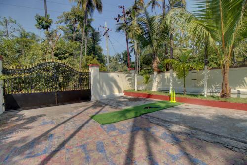 a green skateboard on the ground in a yard at Hotel Snehaprabha - Near to Nagaon Beach Alibaug in Alibaug