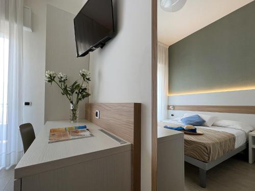 Ένα ή περισσότερα κρεβάτια σε δωμάτιο στο Hotel Pillon