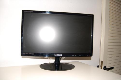 a computer monitor sitting on top of a desk at Rio Piccolo Apartment in Principina a Mare