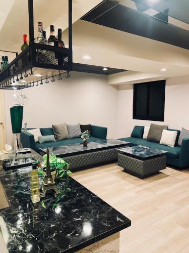 a living room with a couch and a table at Felicity Business Hotel in Taichung
