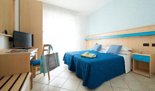 Ένα ή περισσότερα κρεβάτια σε δωμάτιο στο Hotel Pillon