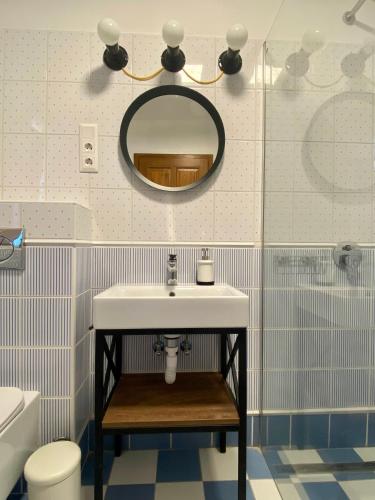 a bathroom with a sink and a mirror at Segesdy Villa in Balatonalmádi