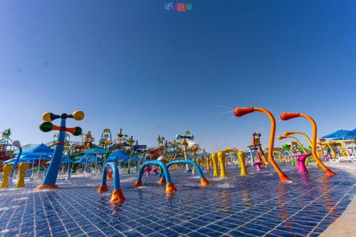 a water park with a bunch of water slides at Neverland City Hurghada - Pickalbatros in Hurghada