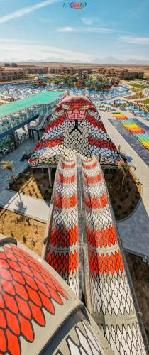 an overhead view of a swimming pool with a building at Neverland City Hurghada - Pickalbatros in Hurghada