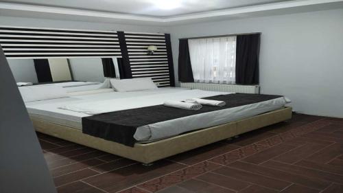 Postel nebo postele na pokoji v ubytování World Center Taksim Hotel