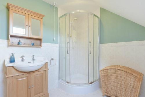 a bathroom with a shower and a sink at The Wynd in Bamburgh