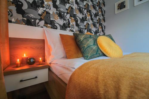 Posteľ alebo postele v izbe v ubytovaní Apartamenty KAPRYS - Centrum