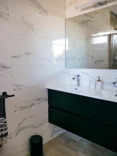a bathroom with a sink and a mirror at La Source - gîte en Drôme provençale - Allan in Allan