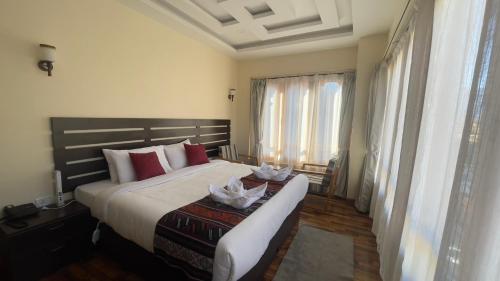 Katil atau katil-katil dalam bilik di Zhideychen Resort