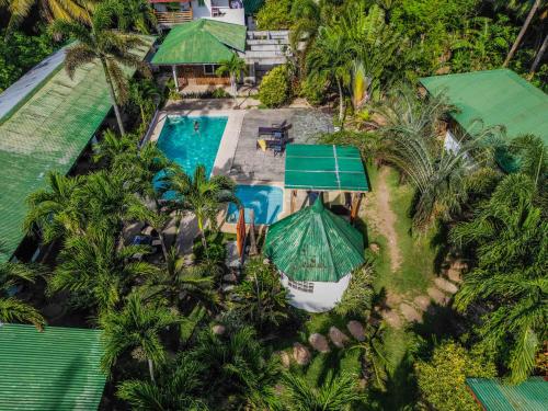 an aerial view of a resort with a pool and palm trees at Charisma Beach Resort in Siquijor