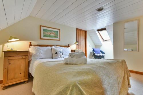 Voodi või voodid majutusasutuse Sandpiper Cottage Low Newton toas