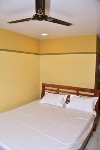 A bed or beds in a room at CHANDRA ROYAL RESIDENCY