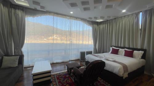 Katil atau katil-katil dalam bilik di Zhideychen Resort