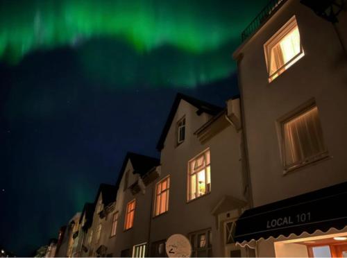 an image of the aurora in the sky above a building at Hotel Local 101 in Reykjavík