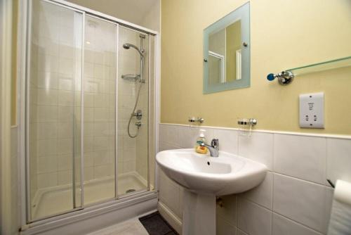 a bathroom with a sink and a shower at Churchside in Alnwick