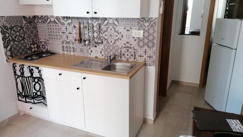 Kuchyň nebo kuchyňský kout v ubytování Apartman Novalja