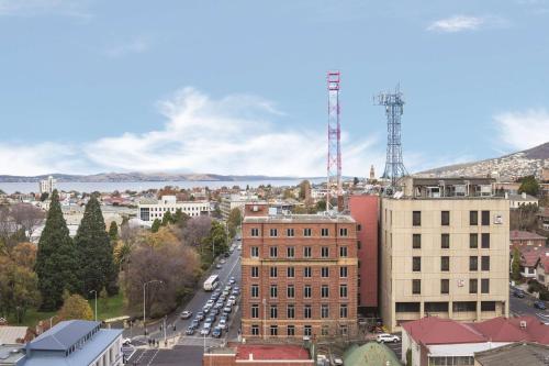 an aerial view of a city with buildings and cars at Travelodge Hotel Hobart in Hobart