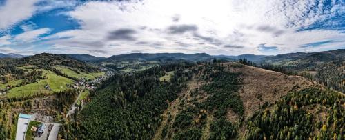 an aerial view of a valley with mountains and forests at Gościniec Smrekowa Chata in Glinka