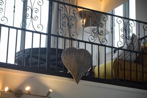 a heart hanging on a iron fence at The Snug in Embleton